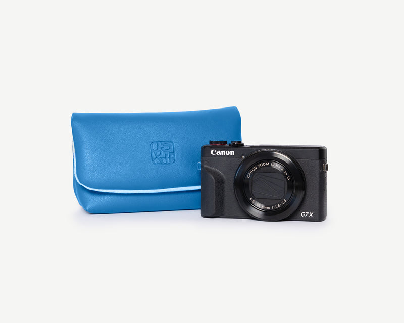 Luxury designer-inspired camera pouch for film photographers and Canon G7X users, offering stylish protection in a modern, crossbody handbag style.