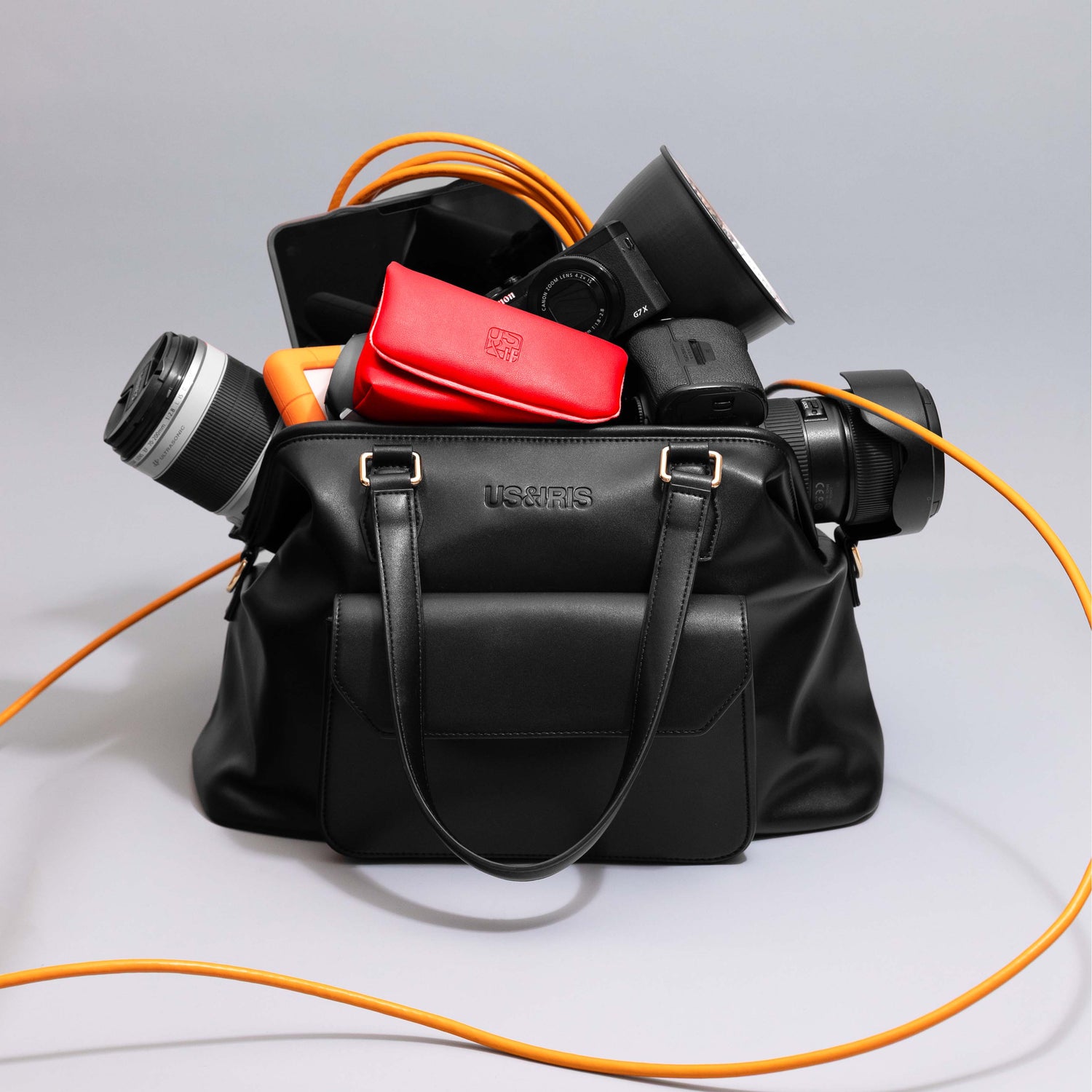 Noir Mirage stylish black camera bag  and camera pouch made from vegan leather, designed as a chic crossbody handbag for professional photographers, travel bloggers, and content creators. DSLR, Mirrorless cameras or digital cameras like G7X, Film Camera or point and shoot 
